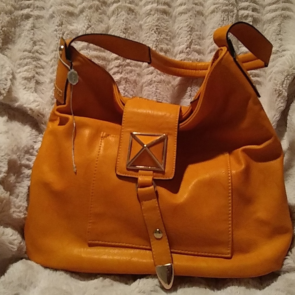 Miztrigue mustard gold purse NWT.